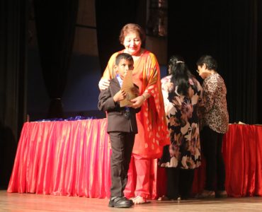 Principal Wendy Holsinger with a young prize winner